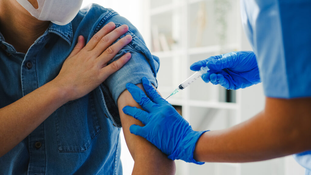 Free flu vaccine in Woolloongabba at Gabba Medical Centre with doctor administering flu shot